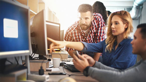 three-people-working-at-PC